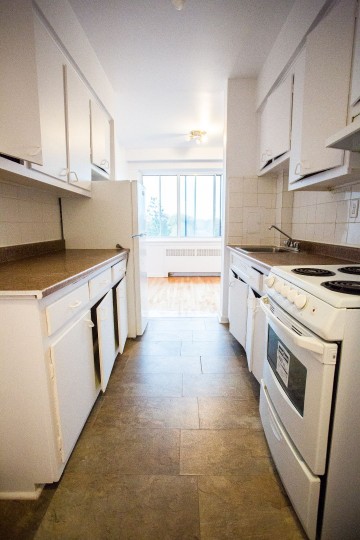 kitchen equipped with fridge and stove